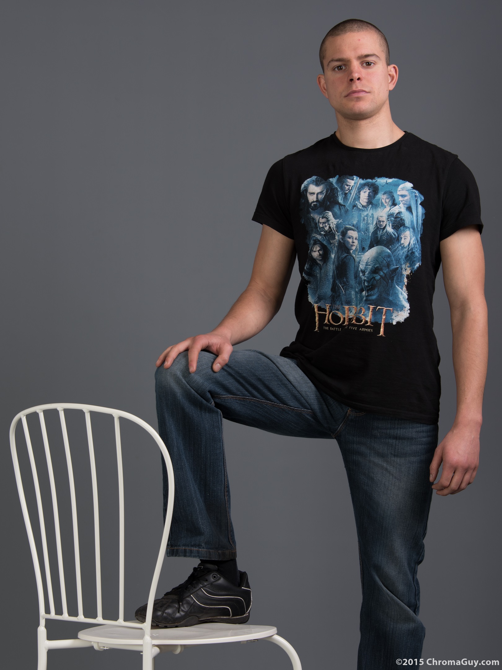 Guy with one foot up on chair