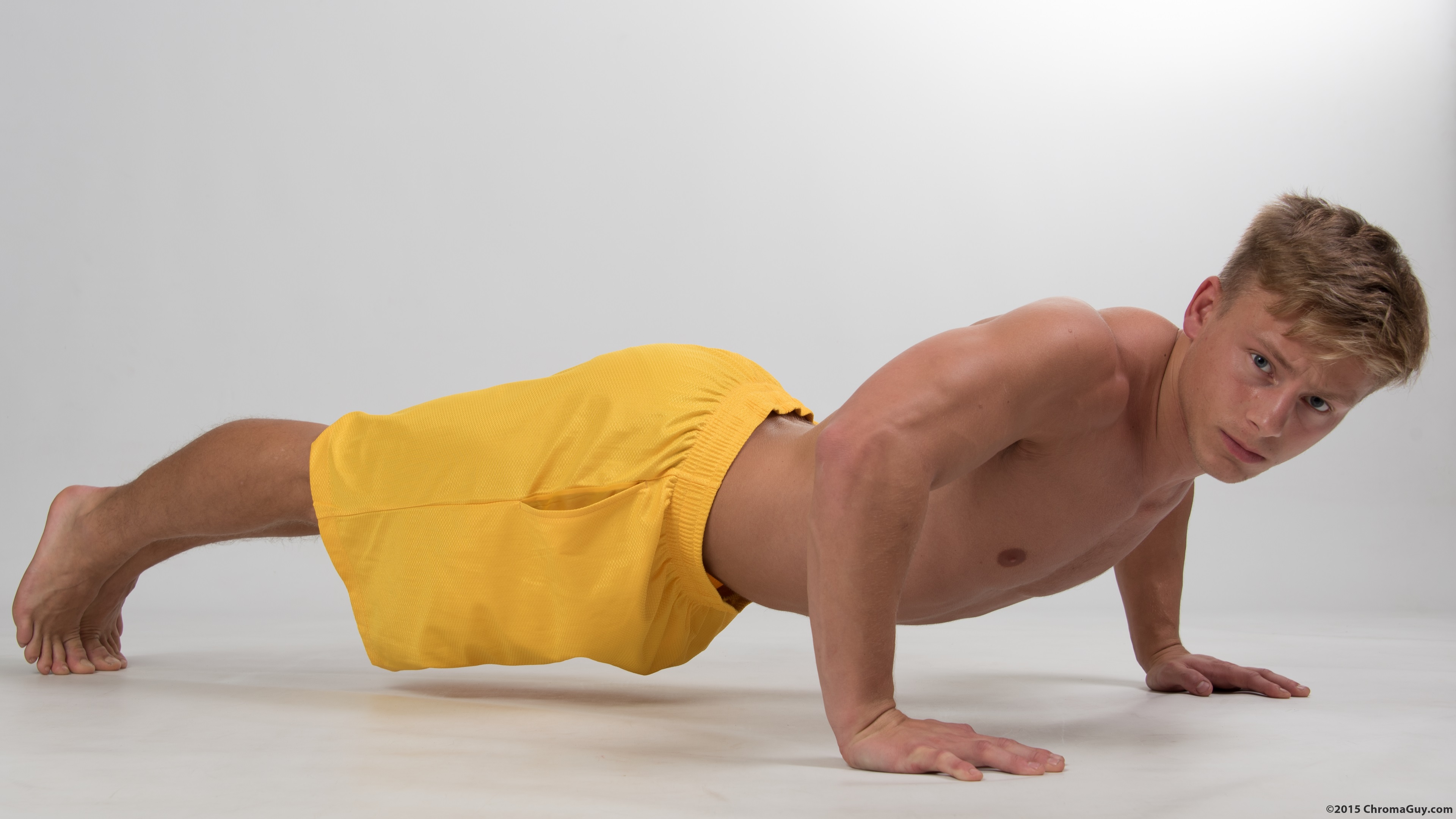 Topless guy doing pushups