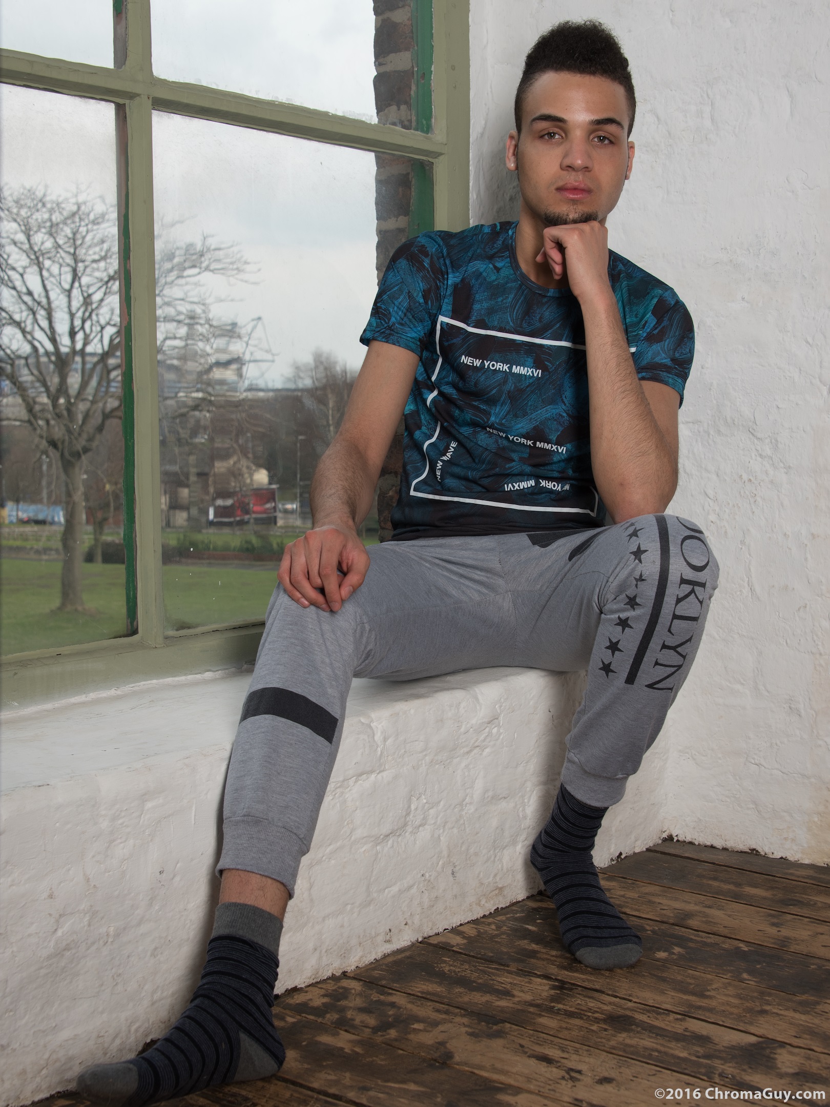 Guy sitting in trackies