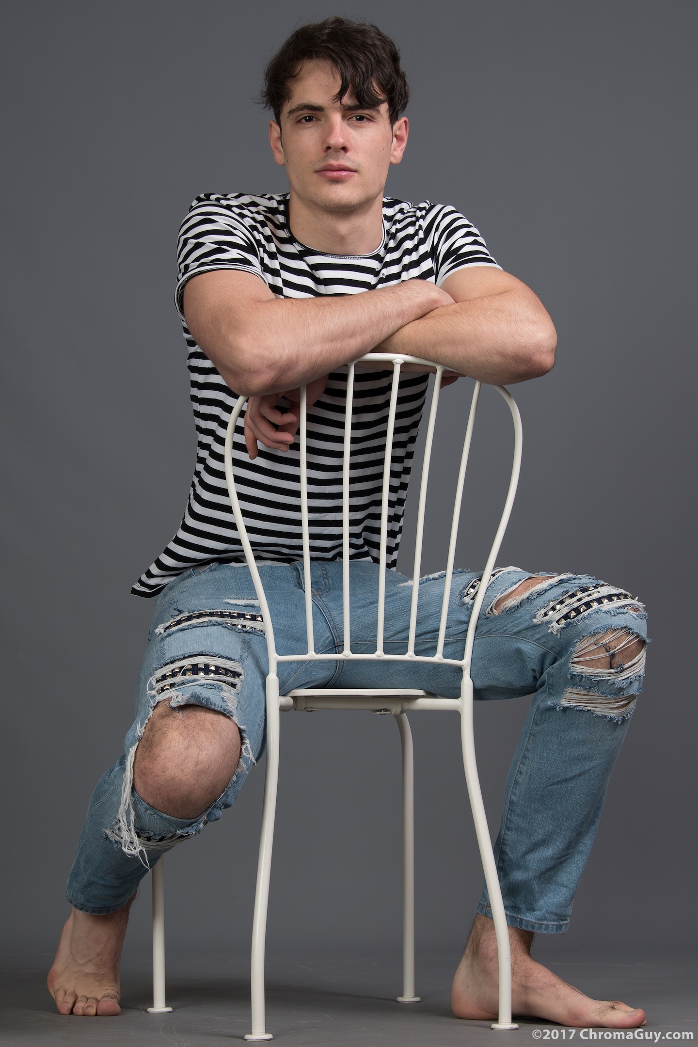 Guy in jeans sitting