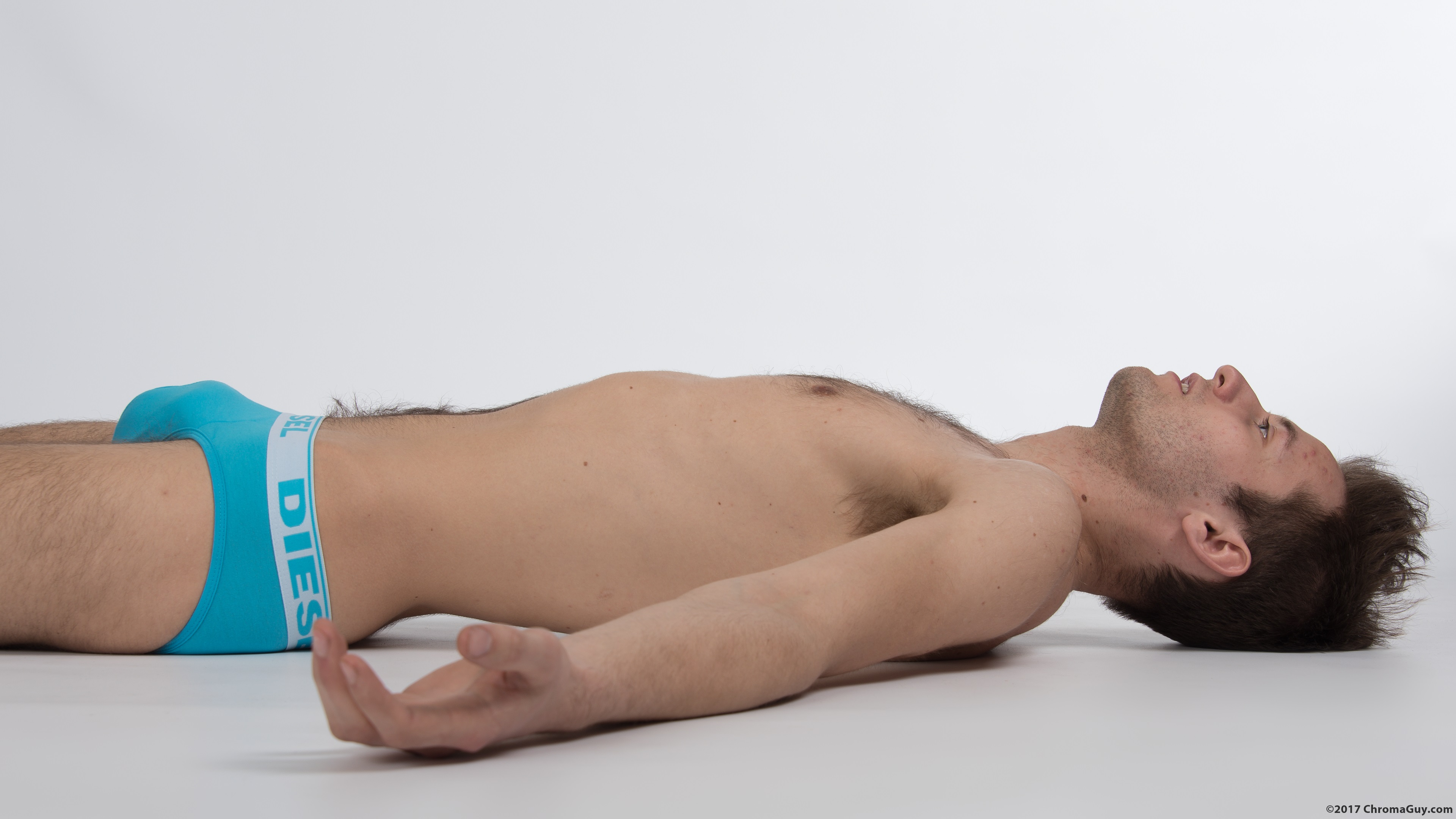 Guy in underwear lying face up